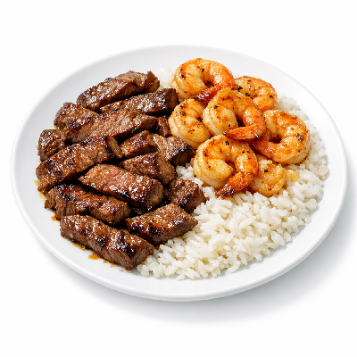 https://eato.health/food-images/feast/act/applebee-s-sizzling-entrees-skillet-fajitas-with-rice-shrimp-and-steak-14387315-1.webp