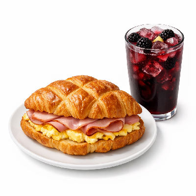https://eato.health/food-images/feast/act/ihop-criss-croissants-ham-eggs-combo-with-blackberry-lemonade-14712335-1.webp