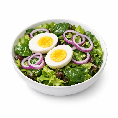 Mixed greens salad with boiled egg and red onion