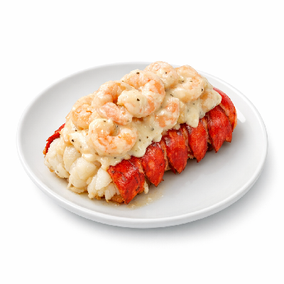 https://eato.health/food-images/feast/act/red-lobster-lobsterfest-creamy-shrimp-topped-lobster-tail-17732913-1.webp