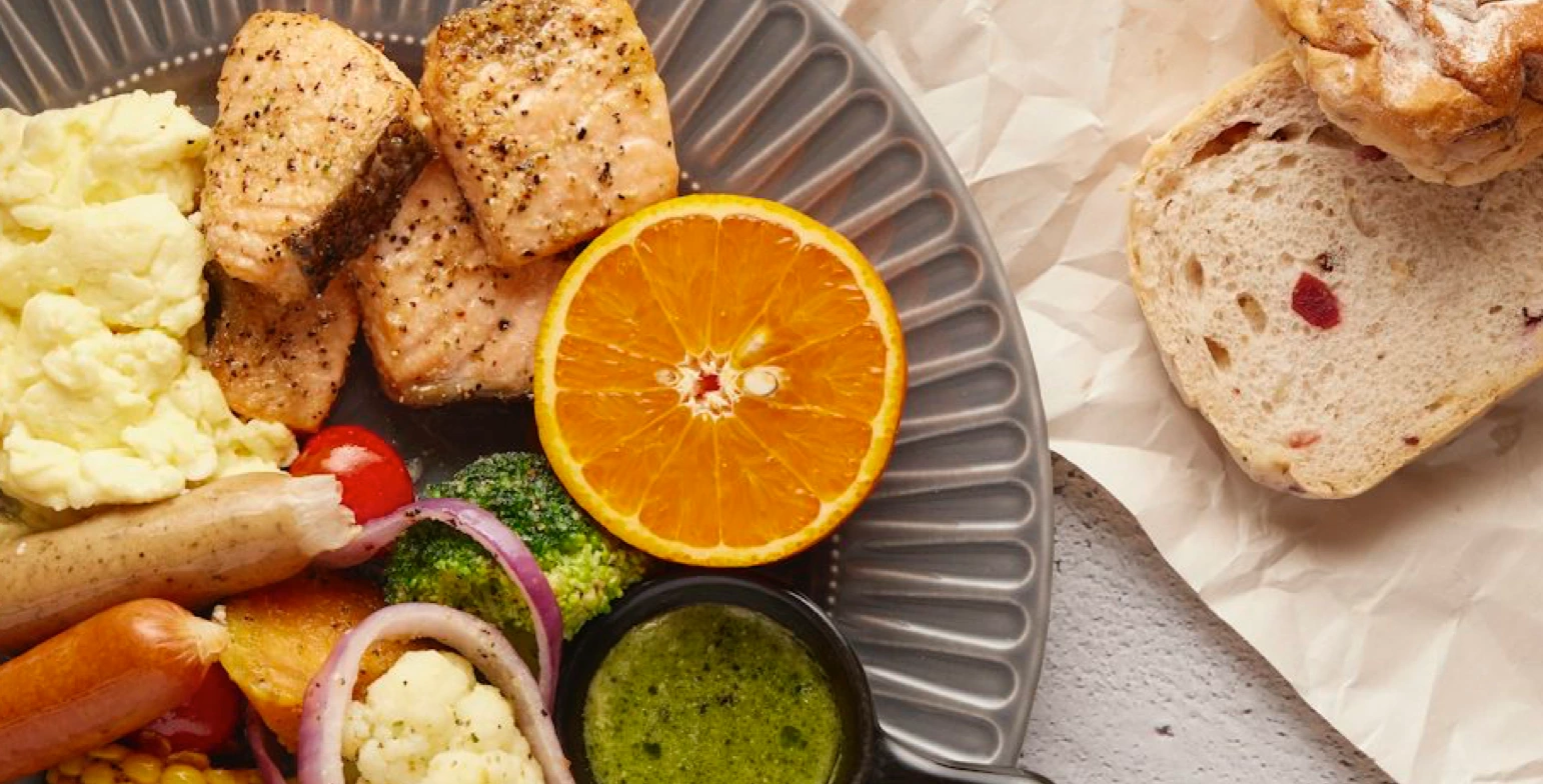 Easy high protein diet with low carb vegetables, baked salmon with broccoli for clean eating and weight loss.