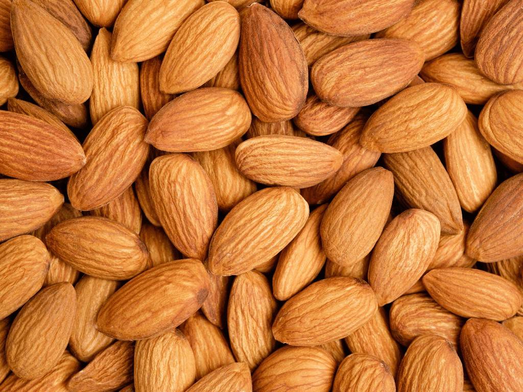 Almonds rich in magnesium and healthy fats that help with period cramps and relax uterine muscles during periods