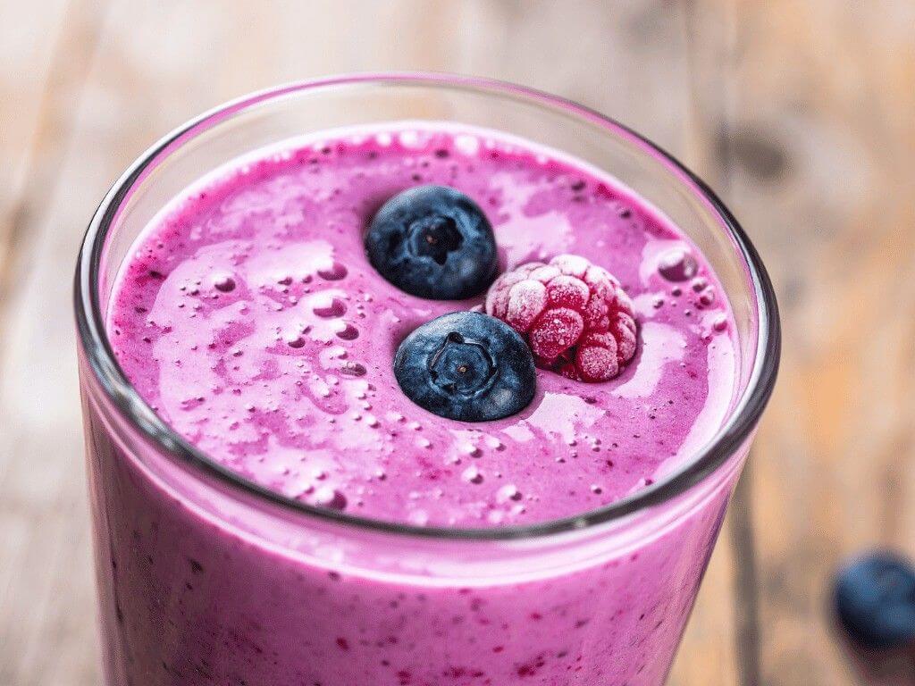 High protein blueberry and raspberry smoothie, a quick grab-and-go meal prep idea for healthy breakfasts or snacks.