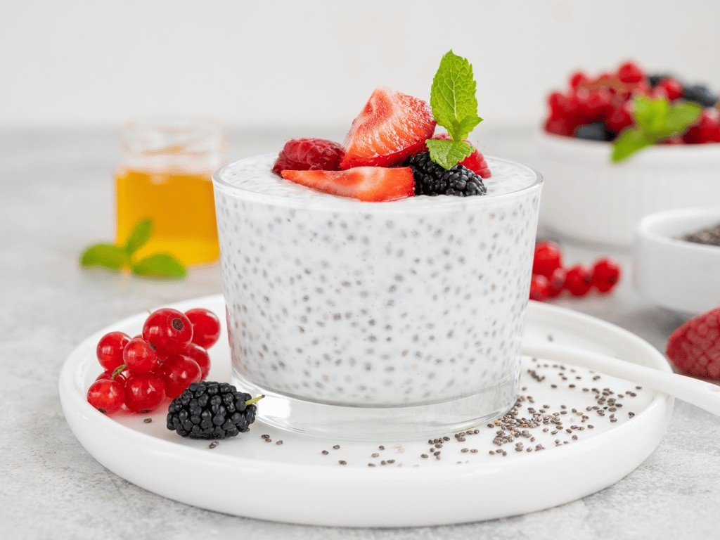 Chia pudding topped with strawberries and blackberries, a simple meal prep breakfast with healthy ingredients.