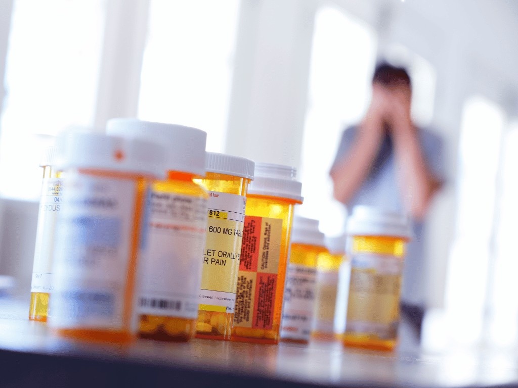 Prescription medication bottles used to manage eating disorder symptoms.