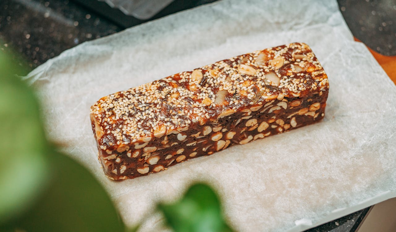 Gluten-free granola bar made with oats, nuts, and dried fruits, offering a chewy and nutritious snack for all ages.