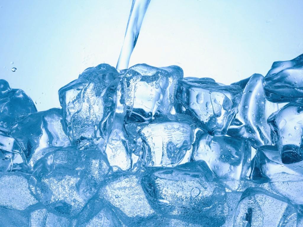ice with water pouring representing ice water hack for weight loss