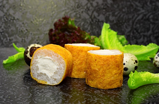 Egg-wrapped sushi rolls with rice and cream cheese, is sushi healthy option rich in protein and flavor.