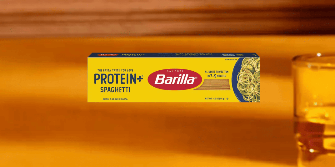 Barilla Protein Plus spaghetti box featuring high protein low carb pasta made with grains and legumes for balanced nutrition.