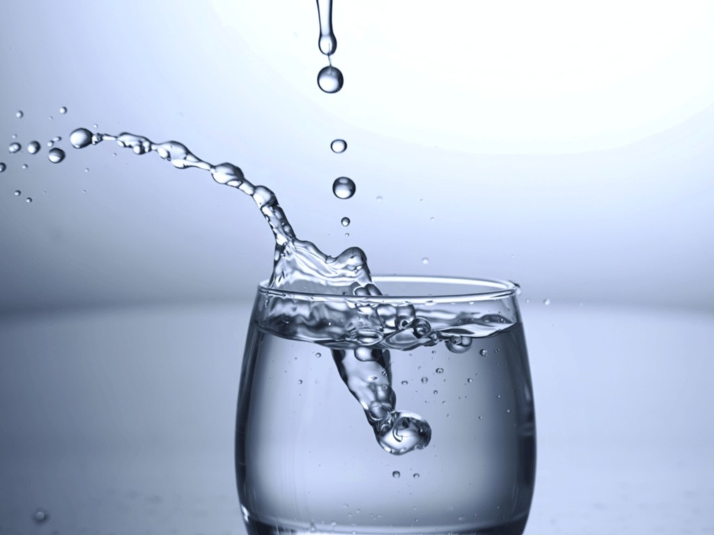 Cup of water representing water fasting practice
