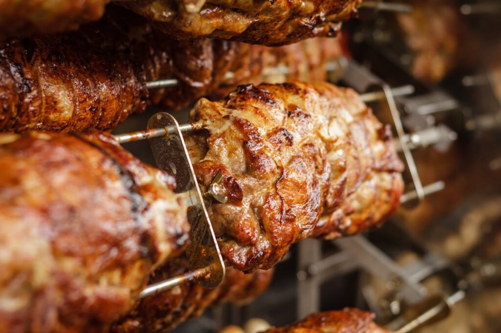 High protein meals increase satiety and reduce hunger in studies, rotisserie style grilled meat on skewers