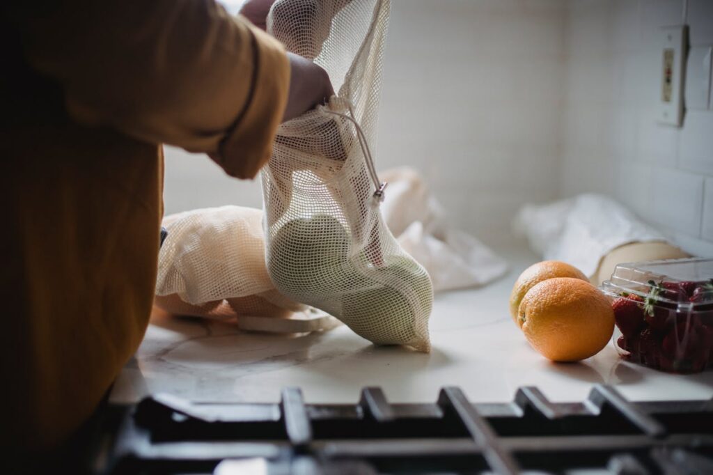 Stone fruits ripening in a paper bag on a kitchen counter to boost natural sweetness and flavor at room temperature.