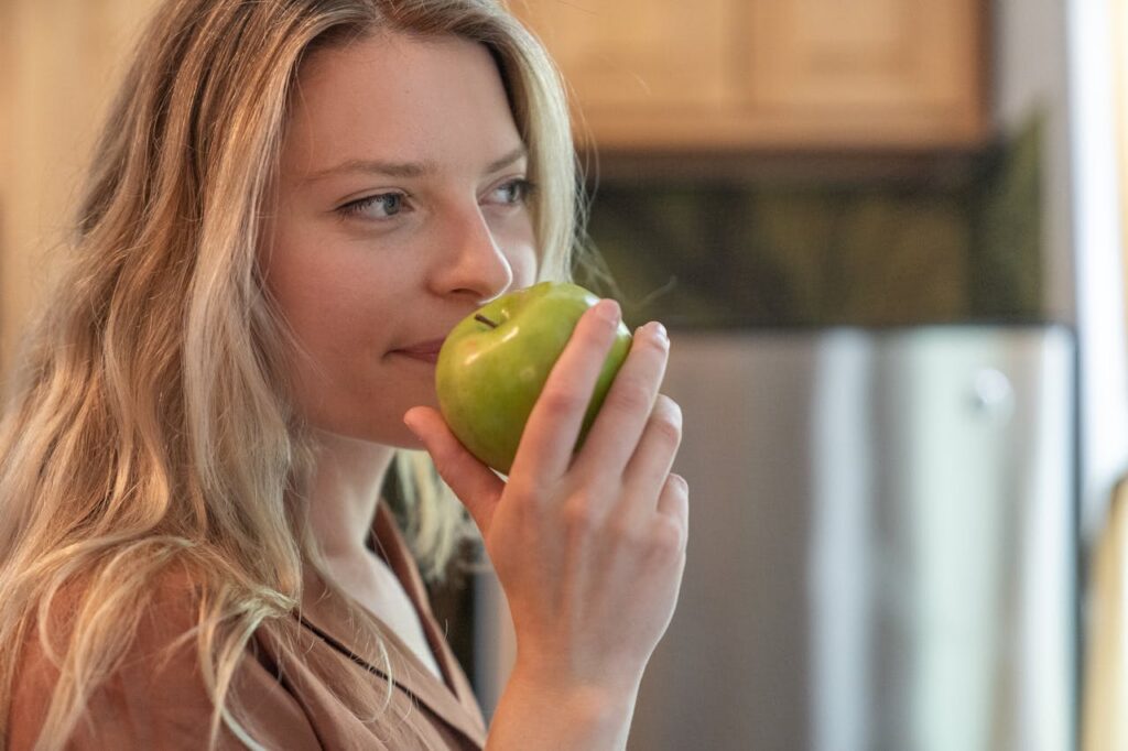 Woman smelling fresh fruit volatile terpenoids responsible for aroma flavor and antioxidant properties