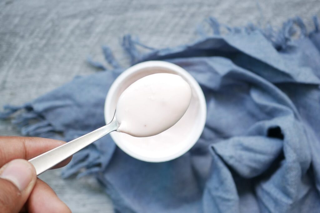 Creamy kefir spooned from a small bowl