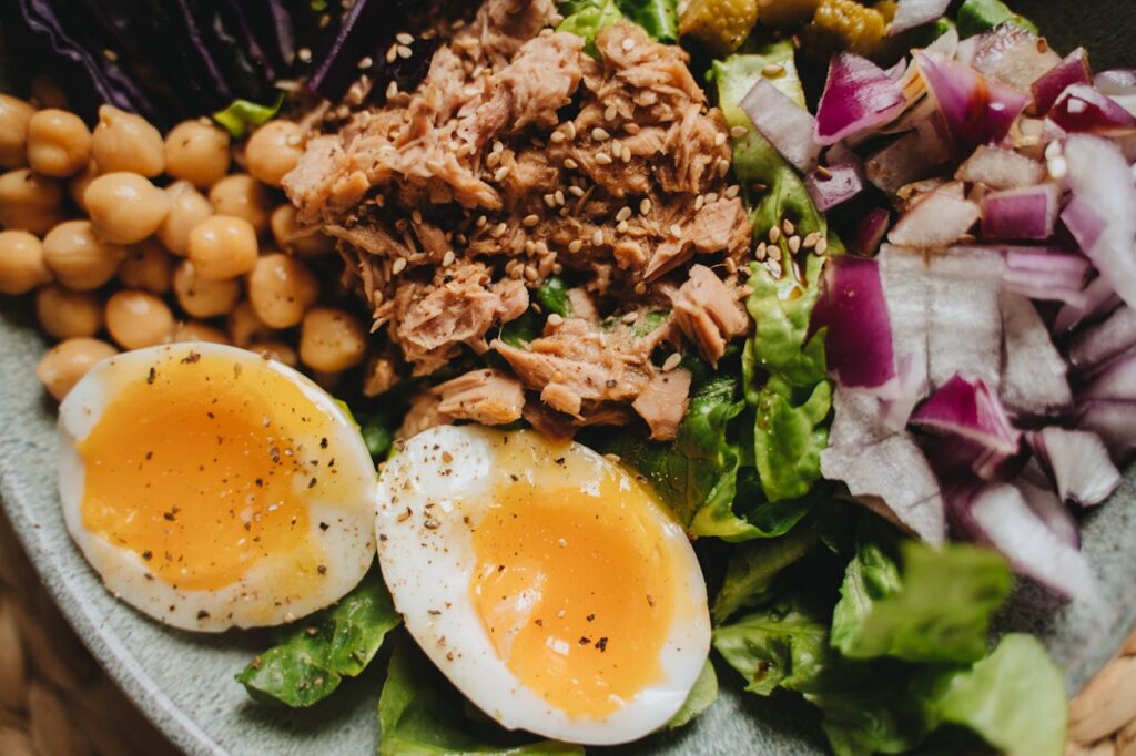 Soft boiled eggs with salad, tuna