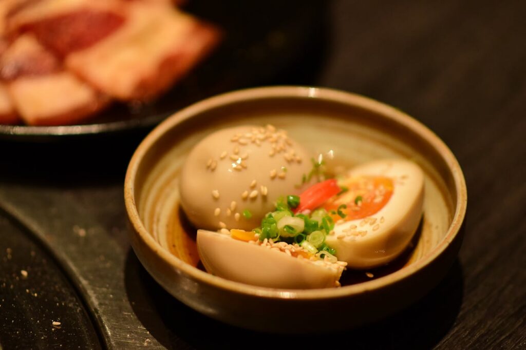 Seasoned soy marinated eggs in a bowl. Eggs are a complete protein with all nine essential amino acids. Perfect for the egg diet.