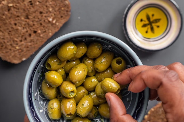 Buying olive oil may not be easy considering markets like Trader Joe's seem to have walls of olive oil.